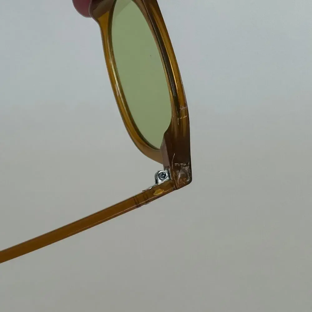 Brown round sunglasses with green